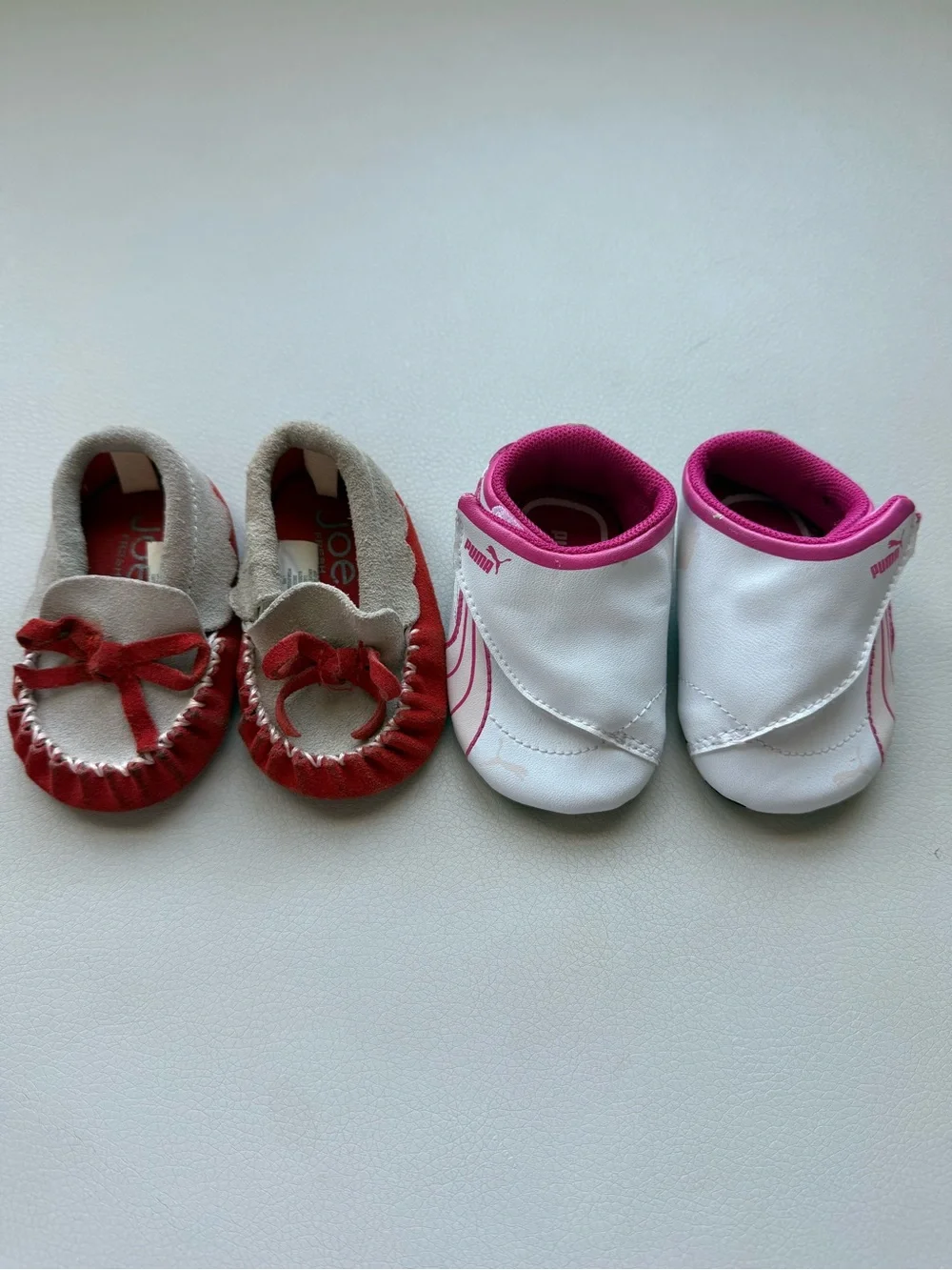 Puma White/ Pink Infant Slip-On Sneakers and brown baby moccasins with orange
